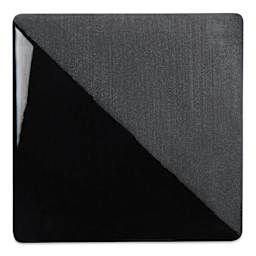 Speedball Ceramic Underglaze - Black, Opaque, fired on white clay bisque tiles, half covered in Speedball Clear Glaze, fired to cone 05