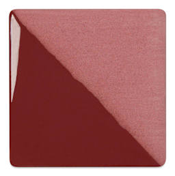 Speedball Ceramic Underglaze - Burgundy, Opaque, fired on white clay bisque tiles, half covered in Speedball Clear Glaze, fired to cone 05