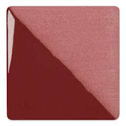 Speedball Ceramic Underglaze - Burgundy, Opaque, fired on white clay bisque tiles, half covered in Speedball Clear Glaze, fired to cone 05