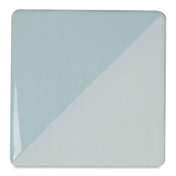 Speedball Ceramic Underglaze - Blue Frost, Opaque, fired on white clay bisque tiles, half covered in Speedball Clear Glaze, fired to cone 05