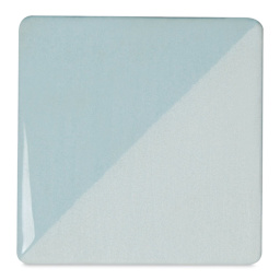 Speedball Ceramic Underglaze - Blue Frost, Opaque, fired on white clay bisque tiles, half covered in Speedball Clear Glaze, fired to cone 05