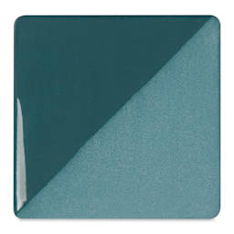 Speedball Ceramic Underglaze - Teal, Opaque, fired on white clay bisque tiles, half covered in Speedball Clear Glaze, fired to cone 05