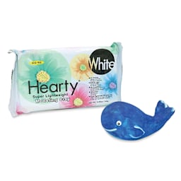 Activa Hearty Clay - Angled view of package with finished and decorated clay whale adjacent
