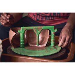 Speedball Boss Base Clay Ball Opener on pottery wheel