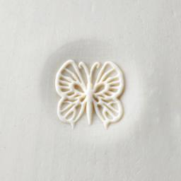 MKM Pottery Tools Curve Top Stamp - Butterfly, stamped into clay