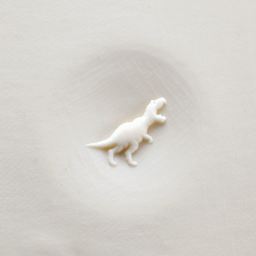 MKM Pottery Tools Curve Top Stamp - T-Rex applied to clay