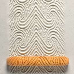 MKM Pottery Tools Hand Roller - Maori Spiral applied to clay