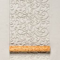 MKM Pottery Tools Twig Hand Roller - Curlicue applied to clay