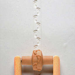 MKM Pottery Tools Small Handle Roller - Footprints applied to clay