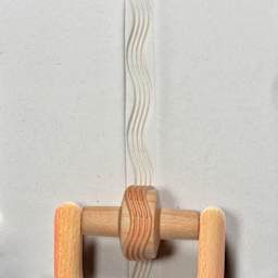 MKM Pottery Tools Small Handle Roller - Wavy Lines applied to clay
