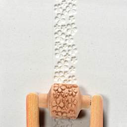 MKM Pottery Tools Medium Handle Roller - Flowers applied to clay