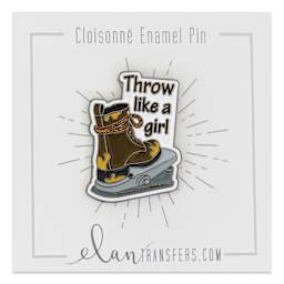 Elan Transfers Enamel Pin - Throw Like a Girl pinned to front of packaging