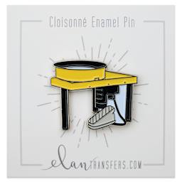 Elan Transfers Enamel Pin - Yellow Pottery Wheel, pinned to front of packaging