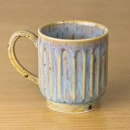 Mayco Stoneware Bisque Mugs - Fluted Mug finished product with light blue and tan coloring