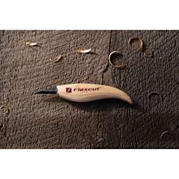 Flexcut Detail Knife laying with wood shavings