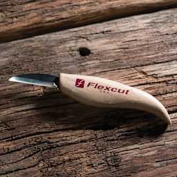 Flexcut Roughing Knife laying on wooden table