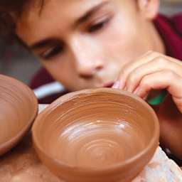 Activa Blackjack Stoneware Clay - child with bowl