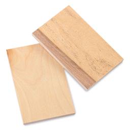 Midwest Products Birch Plywood Pieces - Sheets of plywood in two stacks