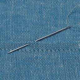 Dritz Sharps Hand Needles - Size 9, Pkg of 20 close-up of needle on fabric