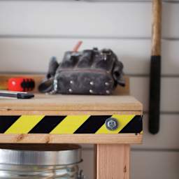 Duck Tape Prints - Black & Yellow Stripes - strip of tape on side of workbench
