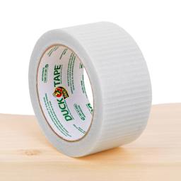 Duck Transparent Tape - 1.88" x 20 yds laying upright on table