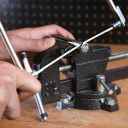 GreatNeck Coping Saw - cutting bolt set in vise