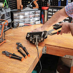 GreatNeck Groove Joint Pliers - in use on work bench