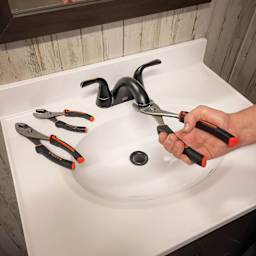 GreatNeck Slip Joint Pliers - in use to adjust sink nozzle