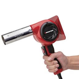 Master Industrial Heat Gun - Side view of hand holding Heat Gun
