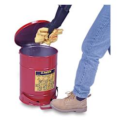 Justrite Oily Materials Waste Cans - Worker depositing oily cloths using foot lever to open can