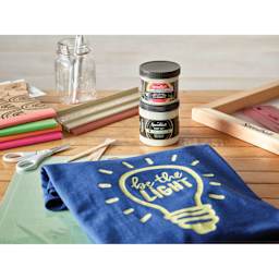 Speedball Night Glo Fabric Screen Printing Inks with painted shirt, lights on