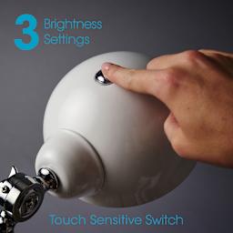 OttLite LED Revive Floor Lamp - Closeup of hand pressing power button
