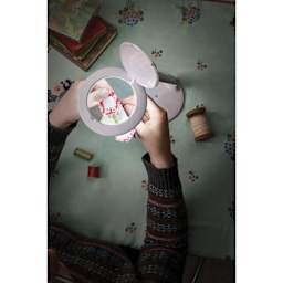 Daylight Halo Go Magnifier Lamp in use view through magnifier