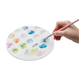 Paint being mixed on the Himi UFO Palette.