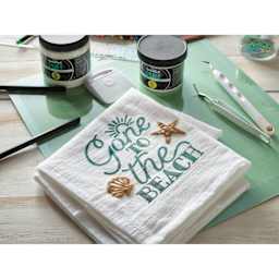 Speedball Puff Fabric Screen Printing Ink Modifier - tea towel with puffed shell and star 