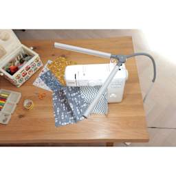 Daylight DuoPro Floor Lamp - top view of lamp lit over sewing table