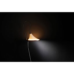 Daylight Cometa Floor Lamp close-up of warm task light and ambient light on in dark space