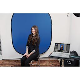 Green Screen Photography Kit - Model in front of Screen with computer nearby
