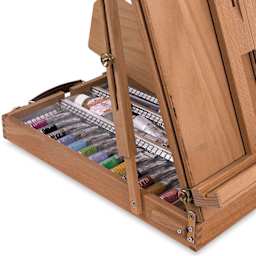 Sketchbox Table Easel - Angled view of Easel filled with paint tubes, not included