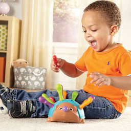 Child Playing With Spike the Fine Motor Hedgehog