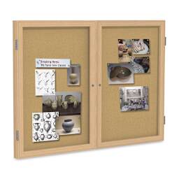 Ghent Natural Cork Bulletin Board - 48" x 36", 2 Door, Oak Frame - holding picture examples (not included)