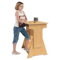 Convertible Student Desk - Student standing at Desk set at highest point
