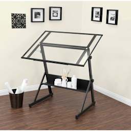 Studio Designs Solano Drafting Table - Charcoal Frame/Clear Glass, stationed inside a room