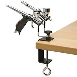 Iwata Universal Airbrush Holder - shown with airbrushes mounted and attached to table