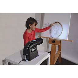 Artograph Tracer Projector - Student tracing artwork projected on canvas