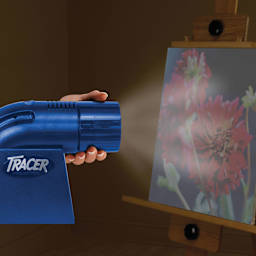 Artograph LED Tracer Projector, in hand adjusting zoom