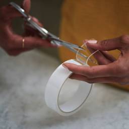 Duck Max Strength Nano-Grab Double Sided Gel Tape - Clear, 0.94 in x 5 ft - cutting section of tape