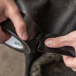 Duck Max Strength Tape - Black, 1.88" x 35 yds being torn