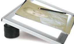 Artograph PadPucks - Shown propping up Light pad at angle