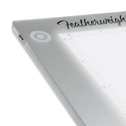 Artograph Featherweight LightPad - 9" x 12" (Close-up of power button in upper left corner) 